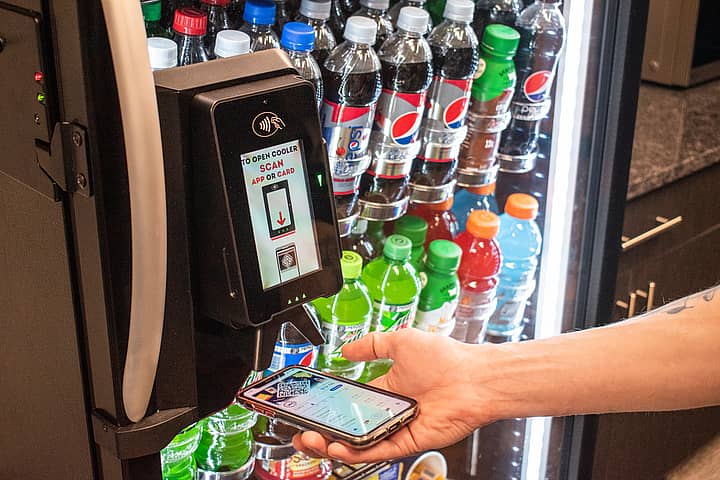 person using touchless smartphone vending payment, a creative vending upgrade